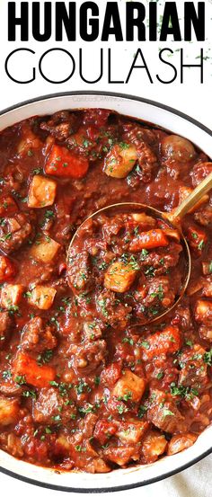 the recipe for hungarian goulash is in a white bowl with a wooden spoon