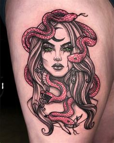 a woman with a snake on her thigh