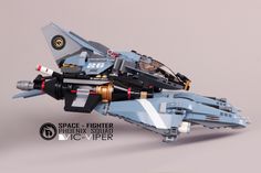 a lego model of a fighter jet is shown in this close up photo with the caption space fighter