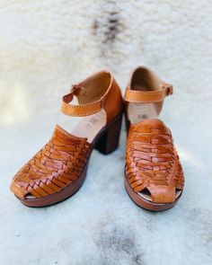 Handmade with intricate woven leather, these strap high heel huaraches are comfortable, classic, and cute! A versatile look that can be dressed up or dressed down, you'll love the stability and practicality of this timeless shoe. Genuine Leather Honey Tan Handmade in Mexico Pro-tip! These naturally run large so if you order a size 7, you will be receiving a size 6. Trust us, it will fit like a 7! Which means if you are a half size, size down. For example, if you are a 7.5 a size 7 should fit you Woven Leather Block Heels, Adjustable Brown Ankle Strap Heels, Brown Heels With Adjustable Ankle Strap, Brown Adjustable Ankle Strap Heels, Casual High Heel Woven Leather Heels, Casual Woven Leather High Heels, Woven Leather Sandals With Block Heel, Leather Sandals With Woven Detail And Block Heel, Spring Adjustable Woven Leather Huarache Sandals