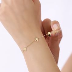 Elevate your style to new heights with our exquisite 14K Solid Gold Dove Bracelet, a delicate piece that beautifully captures the grace and charm of nature. This Dainty Flying Bird Bracelet features five charming doves in flight, suspended on a dainty cable chain. More than just a piece of jewelry, it serves as a profound symbol of peace, freedom, and the inherent beauty of life itself. Symbol of Peace and Beauty: Our 14K Solid Gold Dove Bracelet is more than a mere accessory; it's a statement o Delicate White Gold Bracelet, Delicate 14k Rose Gold Bracelet, Elegant 14k Rose Gold Filled Bracelet, Delicate Yellow Gold Diamond Bracelet, 14k Gold Filled Wedding Bracelet, Wedding 14k Gold-filled Bracelet, Fine Dove Bracelet Medallion, Fine Dove Bracelet, Dove Pendant