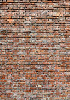 an old brick wall is shown in red