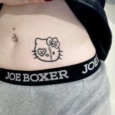 a woman's stomach with a hello kitty tattoo on her belly and name joe boxer