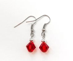 "These beautiful red earrings are made with 8mm red bicones and 4mm sterling plated round beads with nickel free ear wire. Earrings measure 1 1/4\" long. Perfect gift idea for anyone or bridesmaid gift." Red Necklace, Jewelry Techniques, Red Earrings, Diy Crafts Jewelry, Crafts Jewelry, Wire Earrings, Matching Necklaces, Earrings Etsy, Star Earrings