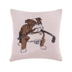 an embroidered pillow with a dog holding a stick