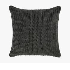 a black knitted pillow on a white background