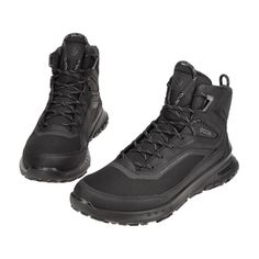 a pair of black hiking boots on a white background