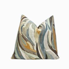 a decorative pillow with an abstract design on it