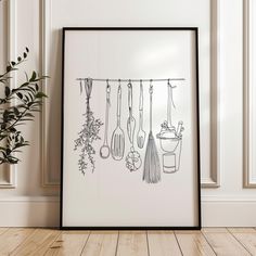 a black and white drawing of kitchen utensils hanging from a line on a wall