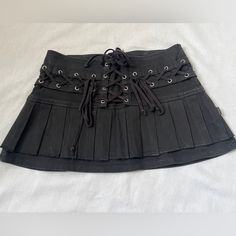 Black Mini Tripp Skirt Gothic Skort For Summer, Gothic Pleated Skort For Spring, Spring Gothic Skort, Spring Gothic Pleated Skort, Rock Style Cotton Skirt For Spring, Spring Cotton Rock Style Skirt, Black Gothic Skort For Summer, Black Cotton Mini Pleated Skirt, Gothic Black Skort For Summer