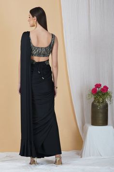 Ooze style and class in this ready to wear saree in a stunning black hue. With a contrasting blouse and belt, this saree is a classic pick for cocktail parties, soirées and weddings!Style Ready to Wear Saree Embellished Belt Contrasting Blouse Classic Black hue Armani silk fabric Specifications Model height - 5'9" Model wearing - S Floor-length Blouse For Diwali Party, Bollywood Style Party Lehenga With Padded Blouse, Party Lehenga With Padded Blouse For Diwali, Evening Georgette Blouse With Unique Design, Evening Georgette Blouse With Self Design, Fitted Georgette Pre-draped Saree For Party, Party Blouse Piece With Cutdana, Floor-length Semi-stitched Blouse For Party, Evening Black Sets With Unstitched Blouse