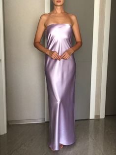 Strapless silk satin slip dress. Can be worn as a bridesmaid dress, party and date dress and for many other occasions. Made of satin silk. DESCRİPTİON:   -Strapless.  -Elastic band on the bust part.  -Adjustable bust.  -Designed for a slim but relaxed fit.  -Unlined.  -Bias cut. İt is a custom made dress, tailored according to your preferences, you can choose the length of the dress and order it with cut on the right side. While ordering write your bust, waist and hips measure, so the dress will be made to your size. Please enquire if you're interested in different color. SIZING INFO: XS/34/US4: bust: 82-86cm (32-33 inch) waist 64-66 cm (24-25 inch)  S/36/ US6: bust: 86-88cm (33-34 inch) waist: 66-68 cm (25-26 inch) M/38/ US8: bust: 88-92 cm (34-36 inch) waist: 68-72 cm (26-28 inch) L/40/ Purple Satin Top Outfit, Lavender Satin Evening Dress, Purple Silk Bias Cut Dress, Purple Satin Dress With Satin Finish, Purple Sleeveless Silk Satin Dress, Purple Silk Satin Evening Dress, Purple Satin Slip Dress For Spring, Spring Purple Satin Slip Dress, Elegant Purple Satin Slip Dress