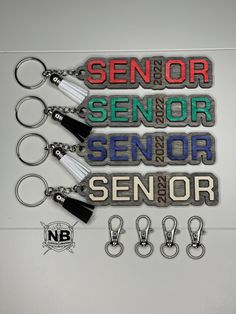 a set of six key chains with the words senior, senior and senior on them