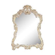 an ornate white mirror on a white wall