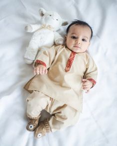 Adorable, made-to-order kurta for infants, toddler, and kid boys! MATCHING FATHER AND SON SETS ARE AVAILABLE ON OUR SHOP! Kurta ➤ Breathable and easy-to-wash cotton fabric ➤ Easy open and close clasp-buttons ➤ No-itch collar and sleeves ➤ Wide neck to easily fit over baby's head ➤ Options for plain or decorative sleeves and neckline Pajama / Pant / Trouser ➤ Breathable and easy-to-wash cotton fabric ➤ White to match with several kotis, kurtas and occasions ➤ Stretchable elastic waistband Choti K Baby Boy Kurta Design Cotton, Baby Boy Kurta Design Kids, Baby Boy Indian Ethnic Wear, Baby Boy Traditional Clothes Indian, Baby Boy Outfits Indian, Baby Boy Kurta Design, Baby Boy Ethnic Wear, Boy Kurta, Boys Kurta Design