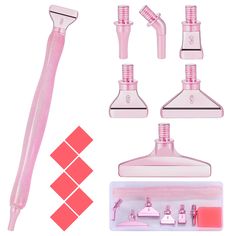 a pink set of bathroom accessories including toothbrushes and soap dispensers