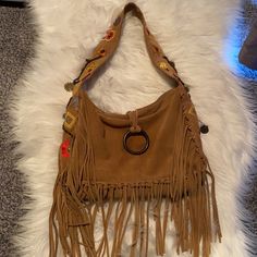 Francesco Biasia Boho Suede Fringe Tan Tote Shoulder Designer Bag New Super Cool With Floral And Metal Charms Details. Inside Pocket. I’ve Small Pen Mark About 1/2” On Back Which I’m Sure Can Be Cleaned And Removed. 12” X 4” X 9.5” 11” Drop Fashion Accessory Pouch Shoulder Bag With Handles, Brown Bohemian Hobo Bag For Shopping, Bohemian Brown Hobo Bag For Shopping, Brown Bohemian Shoulder Bag For Shopping, Bohemian Brown Shoulder Bag For Shopping, Bohemian Rectangular Hobo Bag For Shopping, Bohemian Crossbody Bucket Bag For Shopping, Bohemian Bag With Removable Pouch, Rectangular Shape, Bohemian Satchel Bag With Removable Pouch