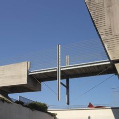 an overhead view of a bridge with wires running over it