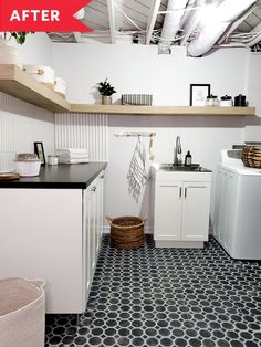 a kitchen with black and white flooring next to a washer and dryer