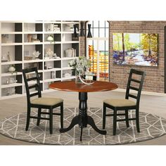 three chairs and a table in a room with bookshelves behind it, on a rug