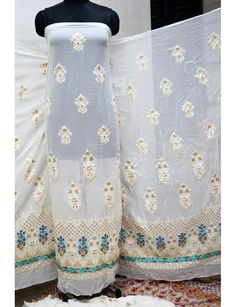 54'' Ivory Dyeable Chikankari Georgette Sequined Embroidered Fabric by the Yard Wedding Dress Indian Sequin Saree Crafting Sewing Costumes. ➤ Color : Ivory, Gold Georgette Sequence Work Fabric(Dye it in any color of your choice) ➤ Width : 54 Inches ➤ Fabric: It is Georgette Sequin Fabric ➤ Code-emb54 Dye it in any color of your choice, beautifully designed Machine Chikankari Fabric with dense embroidery (chikankari), making it an elegant party-wear outfit. You can use this fabric to make dresses White Salwar Kameez With Floral Embroidery, Traditional White Sharara With Floral Embroidery, White Embroidered Chanderi Sets, Traditional White Floral Embroidered Sharara, Embroidered White Chanderi Sets, Semi-stitched Off White Traditional Wear With Floral Embroidery, Festive White Traditional Wear With Floral Embroidery, Bollywood Style Cream Salwar Kameez With Floral Embroidery, White Embroidered Sharara For Diwali