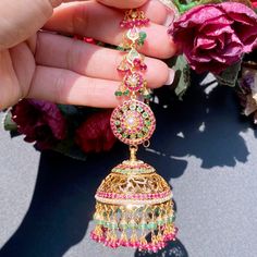 Featuring a pair of stunning bridal jadau jhumkas in 22ct gold. It has been embellished with precious rubies, emeralds and pearls. Magnificently designed, these earrings will make a lasting impression and are sure to become your most treasured heirlooms. It has an ear chain for support and to add that extra touch of royalty The earrings weigh 48.8 GMs including 9.05 GMs of hanging ruby emerald beads. Price Breakup Summary Component Rupees % of Total 22k Gold 218,075 81.2% Stones & Beads 3,265 1. 22k Gold Chandbali Jhumkas For Festive Occasions, 22k Gold Jhumkas For Weddings And Festivals, 22k Gold Jhumkas With Latkans For Wedding, Wedding 22k Gold Jhumkas With Latkans, 22k Gold Tilla Jhumkas For Wedding, 22k Gold Jhumkas For Wedding And Diwali, Bollywood Style 22k Gold Jhumkas For Wedding, 22k Gold Chandbali Jhumkas With Cutdana, 22k Gold Meenakari Jhumkas For Wedding