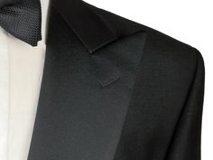 Here is a handsome and classic tuxedo from Luigi Bianchi Manotova under their LUBIAM label. Well established for over a century and renown for quality and style while maintaining their Made in Italy tradition - Luigi Bianchi has been producing classic and updated menswear utilizing Old World craftsmanship and techniques and made with luxurious fabrics from Biella. This is a very full fit jacket with high rise trousers Jacket: Color: Black Fabric: 100% Wool Weight: Year round Model: 1-button Peak