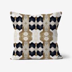 a black and white pillow with an abstract design on the front, in shades of gold