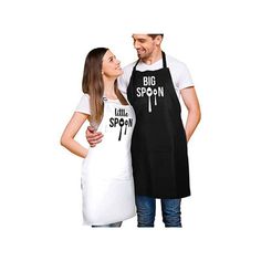 a man and woman standing next to each other wearing aprons that say, big spoon little spoon