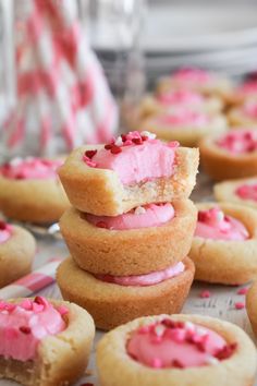 pink frosted cupcakes stacked on top of each other