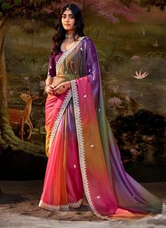 This Bollywood style multi-color saree is crafted with fancy fabric and features a shaded design with patch border embroidery and sequins work. Perfect for ceremonial gifts, this saree offers a unique and elegant look for women. The unstitched blouse can be customized upto 44 inches. Do Note: All the accessories shown are for styling purpose only. Slight color variation may occur due to photographic reasons. Fall and Pico : Done Draping Saree(Ready to wear) : On Request Extra Charges Occasion : Shaded Saree, Indian Wedding Sarees, Fancy Fabric, Indian Party, Bollywood Style, Latest Sarees, Embroidered Wedding, Fancy Blouses, Wedding Sarees