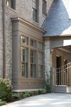 a large brick building with an iron gate