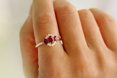 "Ruby Ring / 14k Three Stone Natural Ruby Cluster Ring / Classic Genuine Ruby Engagement Ring 14k Gold / July Birthstone / Promise Ring Features *Made to Order *Gold Kt: 14K (also available in 18K) *Available Gold Color: Rose Gold, Yellow Gold, White Gold *Oval Shape Ruby: 1 pc 6 x 4MM *Oval Shape Ruby: 2 pc 4x3MM *Round Diamonds: 10 pcs 1.55 MM *Ruby CTW: 1.23 ctw *Diamond CTW: 0.16 ctw *Ready to Ship in 7-10 Business Days If you have any additional questions about this product, just hit the \" 14k Gold Birthstone Cluster Ring, 14k Gold Ruby Ring With Halo Setting For Anniversary, 14k Gold Three Stone Birthstone Ring For Anniversary, Anniversary 14k Gold Three Stone Birthstone Ring, Red Three Stone Anniversary Rings, Red Three-stone Anniversary Rings, 14k Gold Cluster Ring Gift, Red Three Stone Rings For Anniversary, 14k Gold Cluster Ring For A Gift