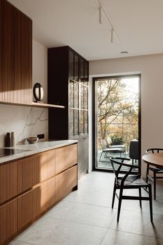 the kitchen is clean and ready to be used for cooking or dining room furniture, as well as an outdoor patio