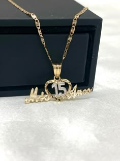 Ioka - 14K Two Tone Gold Sweet 15 Years old Birthday Quinceanera Heart Mis 15 Anos Charm Pendant Necklace with 1.5mm Valentino Chain ✅ PENDANT SPECIFICATIONS:  ➤ Single Sided  ➤ Height: 0.43 in. (11 mm)  ➤ Width: 0.98 in. (25 mm)  ➤ Average Weight: 0.85 gr. ✅ CHAIN SPECIFICATIONS:  ➤ Width: 1.5 mm  ➤ Clasp Type: Spring Ring  ➤ Made with High Quality Metals  ➤ Strong and Secure to hold Pendant charms.  ➤ Fits Into Bale : 2 ✅SHIPPING CONTENTS: ➤14K Gold Chain & Pendant ➤Jewelry Box ✅ PREMIUM 14K GOLD:  Our jewelry is crafted from durable high quality materials, gems, and stones; hand-stamped for authenticity as well as FTC law approved. Unlike cheap costume jewelry, our long lasting jewelry is easy to polish and and won't permanently tarnish or rust! ✅AFTER SALES SERVICES: Limited Lifetime W Quince Necklace With Name, Quinceanera Necklace Gold, Quinceanera Necklace, Quinceanera Jewelry, 15 Necklace, Gold Chain Pendant, Gold Chain With Pendant, Gold Jewelry Necklace, Sweet 15