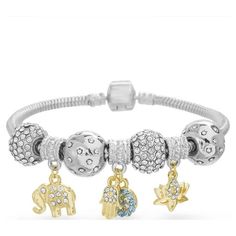 The Lesa Michele Women's White Crystal Charm Beaded Snake Chain Bracelet is a stylish and versatile piece of jewelry designed to cater to the modern woman's fashion preferences. This bracelet features a collection of charming symbols, including the Evil Eye, Elephant, Hamsa, and Lotus Flower. Each charm carries its own unique significance and symbolism, making this bracelet not only fashionable but also meaningful. The bracelet is crafted with a snake chain adorned with white crystal beads. This combination of beads and the snake chain adds texture and visual interest to the piece, creating a dynamic and eye-catching accessory. The bracelet incorporates both yellow gold-tone and silver-tone elements, providing versatility and allowing it to complement a wide range of outfits and jewelry pi Beaded Snake, Beaded Heart, Snake Chain Bracelets, Elephant Charm, The Evil Eye, Woman's Fashion, A Snake, Crystal Charm, The Snake