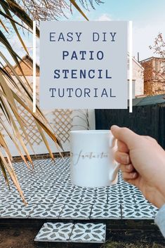 a hand holding a coffee mug with the words easy diy patio stencil