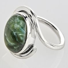 A stone mined in Siberia, exotic Seraphinite is named after angels. Reflective like cat's eye, it has feathery "plumes" like the wings of seraphim. Oval cabochons are set in sterling silver bezels. Ring with wraparound band is ¾"; whole sizes 6-10. Silver Smithing Jewelry, Style Vision Board, Colorful Crystals, Silversmith Jewellery, Jewelry Stones, Eyeglass Chain, Rings Jewelry Fashion, Silver Shop, Made Jewelry