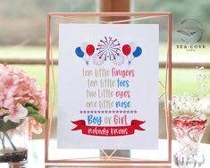 a card with the words for little fingers, two little toes and one little nose are placed next to some flowers