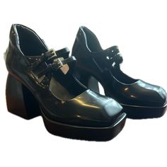 Don’t Sleep On These Fun, Gorgeous Mary Jane’s With A Twist. A Platform, Mary Jane Pump Gets An Edgy Update With A Boxy Square Toe And Sits On An Exaggerated, Flared Block Heel. Perfect For Fall Dark Academia Vibes, Or Even Your Delux Wednesday Adam’s Costume For Halloween. These Are A Versatile Shoe Perfect For Fall And Winter. 3.5" Heel; 1" Platform Square Toe Adjustable Two-Buckle Vamp Straps Platform Flared Block Heel Leather Upper And Lining Synthetic Sole Padded Heel For Comfort Fall Dark Academia, Dark Academia Shoes, Goth Mary Janes, Ankle-high Platform Mary Janes, Jeffrey Campbell Mary Janes, Academia Shoes, Jeffrey Campbell Platform Heels, Dark Academia Vibes, Mary Jane T-strap Heels With Buckle Closure