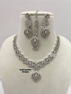 American Diamond Necklace Set comes with earrings and Tikka / CZ Necklace/Indian Jewelry/ Reception Jewelry/ Bollywood Jewelry/ clear silver    All items are shipped from Brampton, Ontario, Canada. If you need your item by a certain day, please reach out to us for express delivery option before placing the order so that we can update the shipping for you. Standard shipping/delivery timeline Below are the delivery timeline estimates. We dispatch all orders by the next business day. ---> USA delivery timeline * 3-6 business days to major urban centers in USA. It may take days extra to remote locations ---> Canada delivery timeline  * 2-3 business days - GTA  & Montreal  * 2-4  business days - Rest of Ontario/Quebec * 3-6 business days-  Rest of Canada    ---> Europe/Middle East timeline * 5- Classic Silver Jewelry Sets With Brilliant Cut, Silver Cubic Zirconia Jewelry Set, Round Cut, Dazzling White Sterling Silver Jewelry Sets, Silver Diamond Cut Jewelry Sets For Anniversary, Silver Round Cut Jewelry Set For Formal Occasions, Formal Silver Jewelry Set With Round Cut, Elegant Silver Jewelry Sets With Cubic Zirconia, Classic Silver Cubic Zirconia Jewelry Sets, Silver Jewelry Sets With Brilliant Cut For Formal Occasions