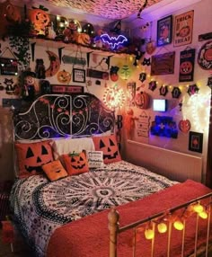 a bedroom decorated with halloween decorations and lights