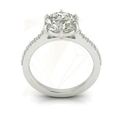 a white gold engagement ring with diamonds on the band and an oval shaped center stone