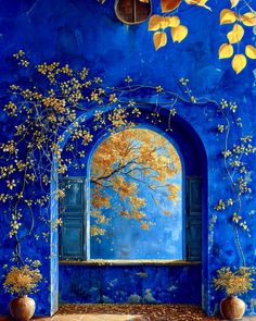 an artistic painting on the wall of a blue building with yellow flowers and leaves in vases