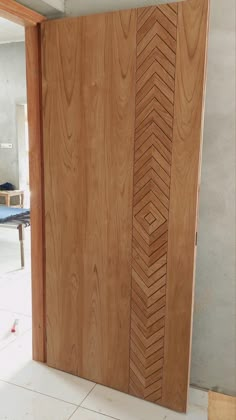 the door is made out of wood and has an arrow design on it's side