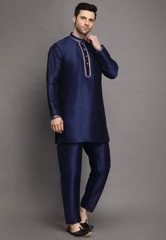 Art Silk Kurta in Navy BlueThis Readymade attire is Enhanced with Buttons. Crafted in Chinese Collar Neck and Full SleeveAvailable with an Art Silk Pajama in Navy BlueDo note: Footwear shown in the image is for presentation purposes only. Half to one inch may vary in measurement. (Slight variation in actual color vs. image is possible) We sell all kinds of menswear. Mens Kurta | Mens Kurta Pajama | Mens Sherwani | Mens Sherwani Sets | Traditional Menswear | Partywear Menswear | Indian Mens Dress Silk Blue Kurta With Resham Embroidery, Silk Kurta With Resham Embroidery In Blue, Blue Silk Kurta With Resham Embroidery, Blue Sherwani With Resham Embroidery For Navratri, Blue Silk Kurta With Zari Work, Traditional Blue Silk Kurta, Blue Silk Kurta For Diwali, Blue Silk Designer Wear Sets, Blue Silk Kurta For Festive Occasions