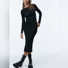 Size M Black Ribbed Long Sleeve Midi Dress, Black Long Sleeve Ribbed Midi Dress, Winter Black Bodycon Midi Dress, Casual Bodycon Midi Dress For Fall, Black Stretch Midi Dress For Winter, Chic Black Bodycon Sweater Dress, Black Ribbed Bodycon Midi Dress, Black Ribbed Winter Dress, Casual Knee-length Sweater Dress For Evening