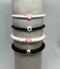 This listing is for 1 heart stretch bracelet. Options are- White round beads w/pink heart, white heishi beads w/pink heart, black round beads with black heart, black heishi beads with black heart, white heishi with hot pink heart (third photo), & black heishi with hot pink heart(third photo). These bracelets are perfect for your kids, their friends, or yourself!  5.5 inches is best suited for a child. 6.5 inches is most requested size for women. Please message me with any questions P.S. I love you was founded to commemorate the shop owner's late father. May we always remember to tell the people in our lives that we love them. Hot Pink Heart, Valentines Bracelets, Bracelet Inspiration, Heart To Heart, Heishi Beads, Colorful Bracelets, Black Heart, Heart Bracelet, Stretch Bracelet