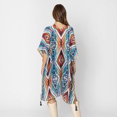 Aztec Print Kimono with Tassel Details – A Bold and Beautiful Statement Piece Add a pop of color and style to your wardrobe with this stunning Aztec Print Kimono with Tassel Details. Featuring a vibrant and eye-catching blend of brown, turquoise, orange, and white, this kimono is the perfect way to make a statement while staying comfortable and chic. Whether you’re layering it over a casual outfit or dressing it up for a special occasion, this kimono adds a touch of elegance and bohemian flair t Sleek Dress, Shades Of Turquoise, Print Kimonos, Bold And Beautiful, Aztec Print, Cozy Sweaters, Hat Hairstyles, Casual Outfit, Pop Of Color