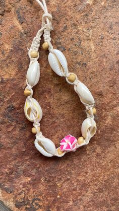 Natural Puka Shell Anklet & Bracelet This is a beautiful and genuine puka shell anklet or bracelet. Hand-crafted with natural shells, this necklace will bring delight to wear in any occasion. The shape and design makes it easy to match any attire that you own. Make it a complete set when you purchase different designs to go along with it.  Please note that because the shells are natural, size and color shade may vary slightly by piece. Casual Cowrie Shell Necklace As A Gift, Adjustable Natural Beaded Bracelets For Beach, White Casual Shell Necklace For Festival, Natural Casual Jewelry For Vacation, Casual Natural Jewelry For Beach, Casual White Shell Necklace For Festivals, Casual Natural Jewelry For The Beach, Casual Natural Jewelry For Vacation, Handmade Natural Beaded Bracelets For Beach